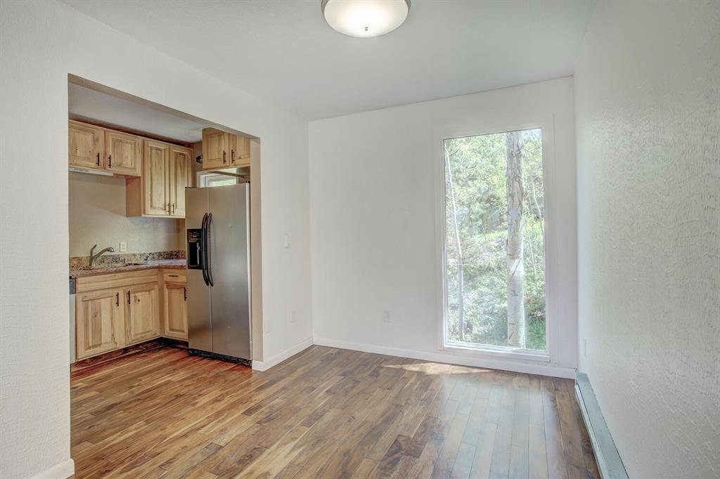347 Deer Path Road Dillon, CO 80435 - Photo 15 of 26 a kitchen with a refrigerator and a sink