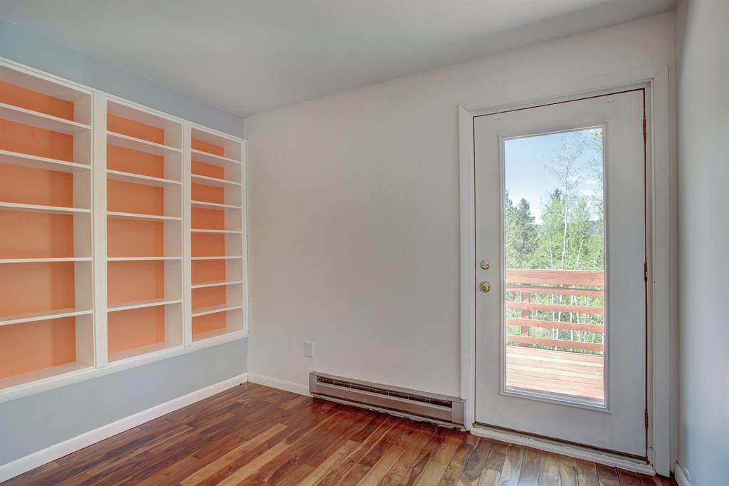 347 Deer Path Road Dillon, CO 80435 - Photo 19 of 26 a view of an empty room with wooden floor and a window