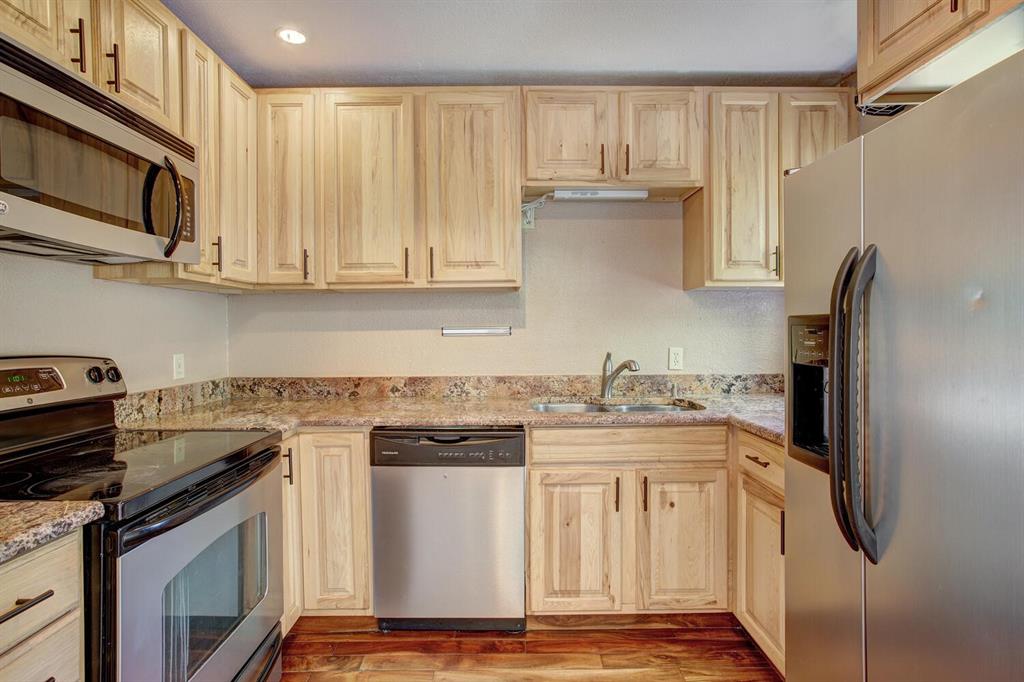 347 Deer Path Road Dillon, CO 80435 - Photo 7 of 26 a kitchen with stainless steel appliances granite countertop a stove a refrigerator and a cabinets