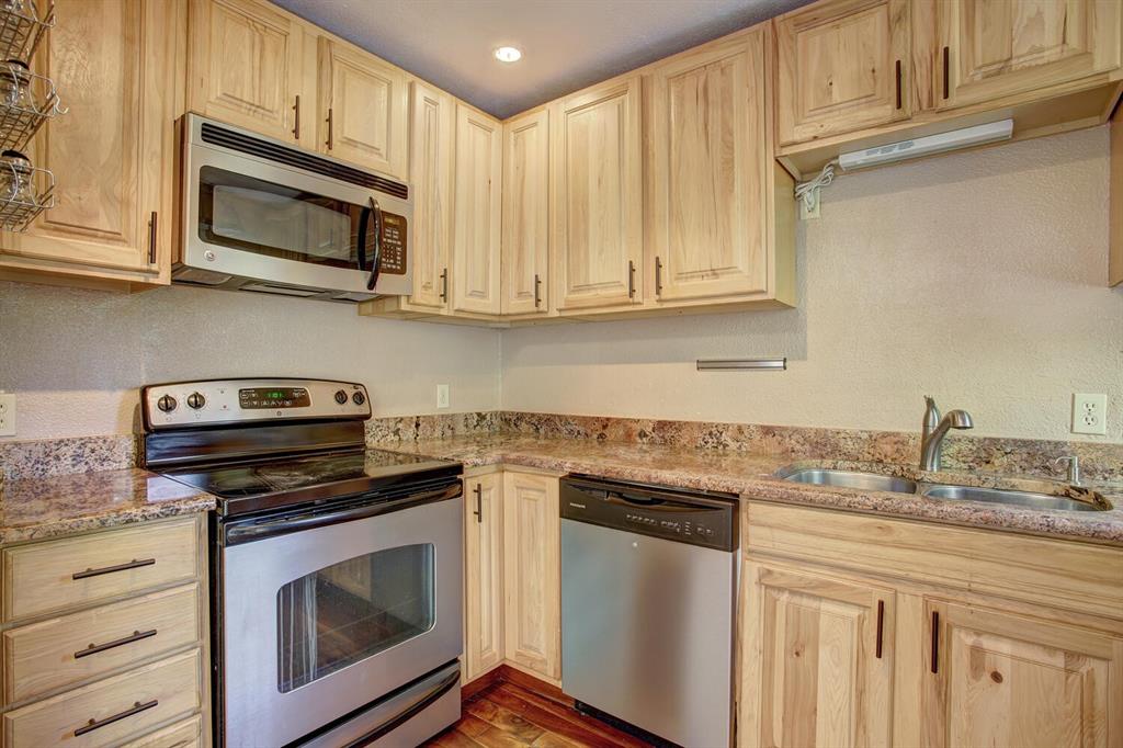 347 Deer Path Road Dillon, CO 80435 - Photo 8 of 26 a kitchen with granite countertop a stove microwave and sink
