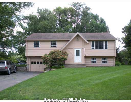 7 Raspberry Lane Ellington, CT 06029 - Photo 1 of 1 a view of a house with a yard and sitting area
