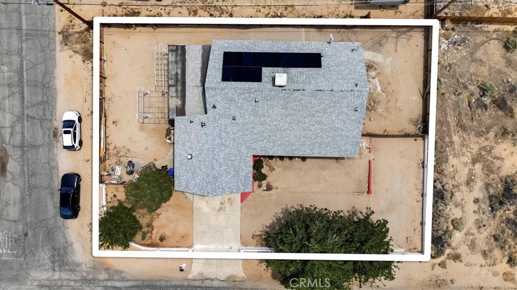 aerial view of a house with a yard and garage