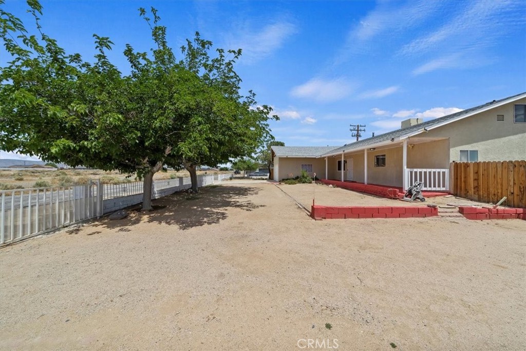 20548 Neuralia Road California City, CA 93505 - Photo 12 of 49 a backyard of a house with table and chairs