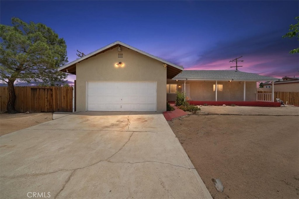 20548 Neuralia Road California City, CA 93505 - Photo 14 of 49 a view of a house with a yard
