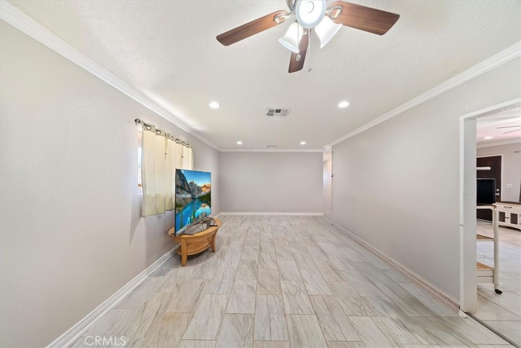 20548 Neuralia Road California City, CA 93505 - Photo 29 of 49 an empty room with stairs and furniture