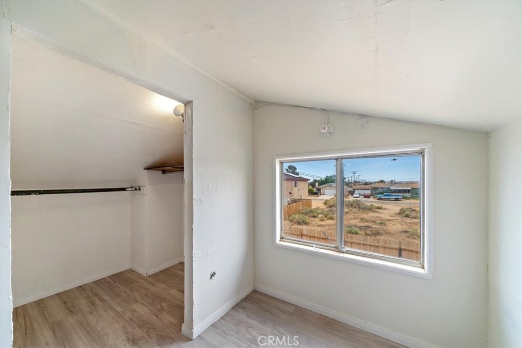 20548 Neuralia Road California City, CA 93505 - Photo 41 of 49 an empty room with windows and closet