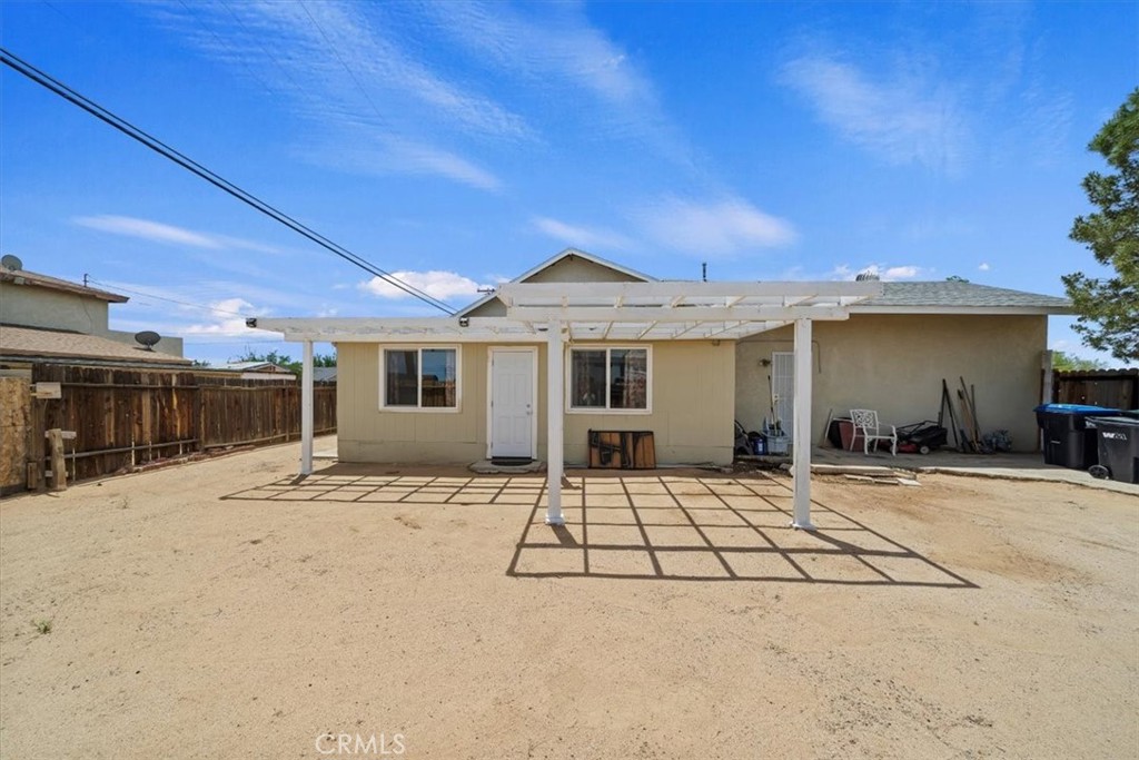 20548 Neuralia Road California City, CA 93505 - Photo 44 of 49 a backyard of a house with yard and barbeque oven