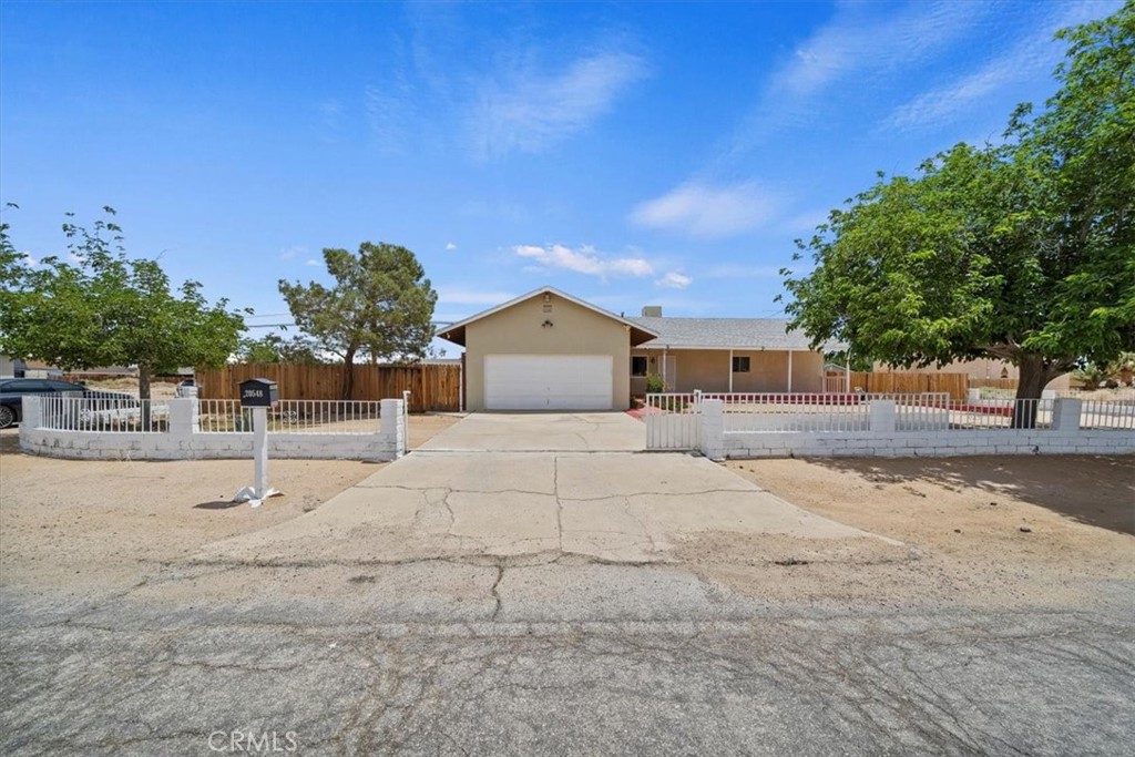 20548 Neuralia Road California City, CA 93505 - Photo 9 of 49 a house with yard in front of it