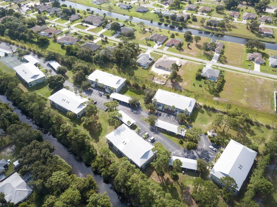 an aerial view of residential houses with outdoor space