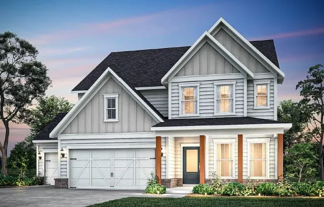 a front view of a house with garage