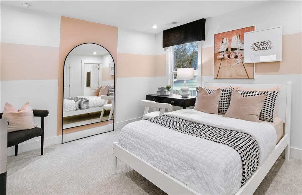 303 Rockledge Bend Southwest Powder Springs, GA 30127 - Photo 15 of 18 a bedroom with a bed and a mirror