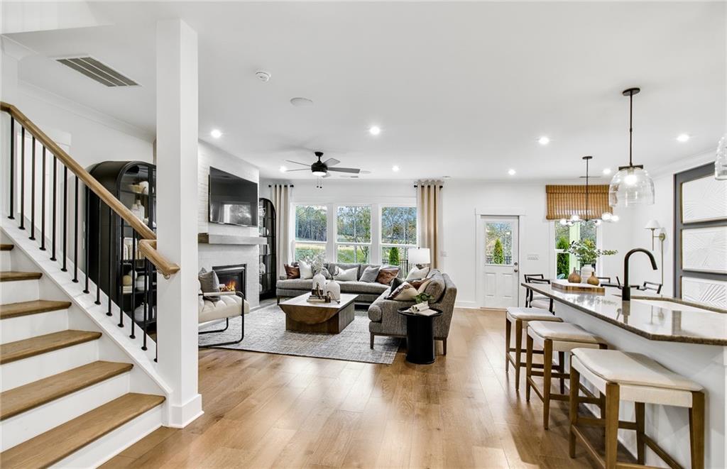 303 Rockledge Bend Southwest Powder Springs, GA 30127 - Photo 3 of 18 a living room with furniture fireplace and a large window