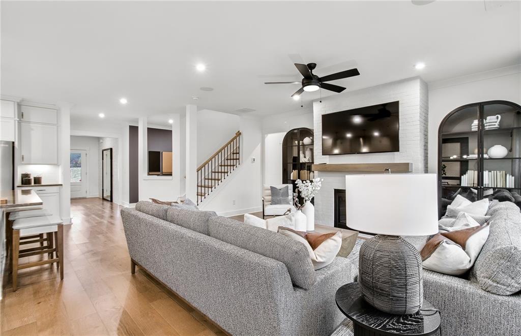 303 Rockledge Bend Southwest Powder Springs, GA 30127 - Photo 5 of 18 a living room with furniture and a flat screen tv