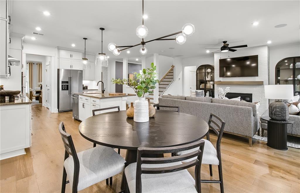 303 Rockledge Bend Southwest Powder Springs, GA 30127 - Photo 8 of 18 a large kitchen with a table and chairs