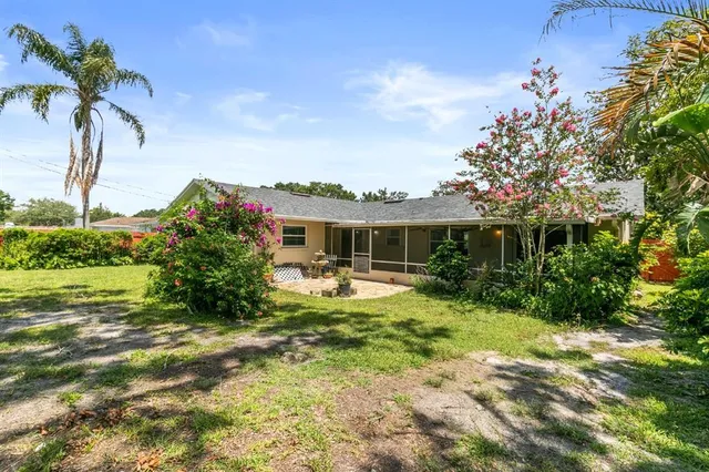 a view of a backyard with a patio