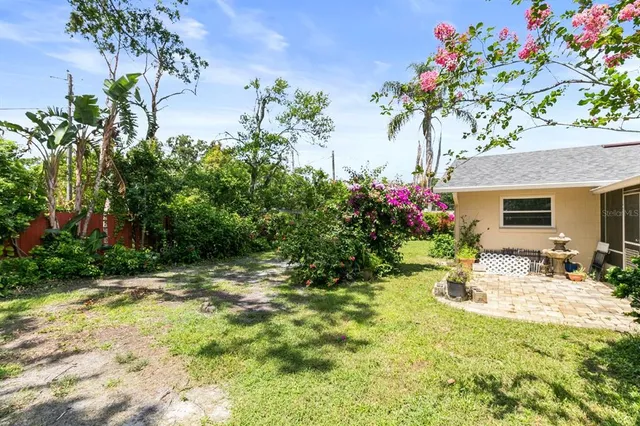 an aerial view of a house with yard