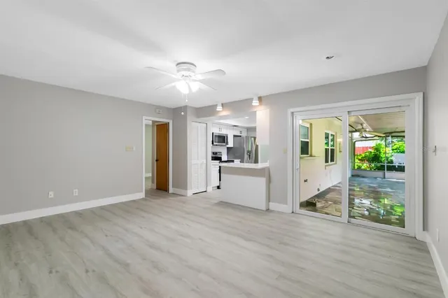 a view of an empty room with a window