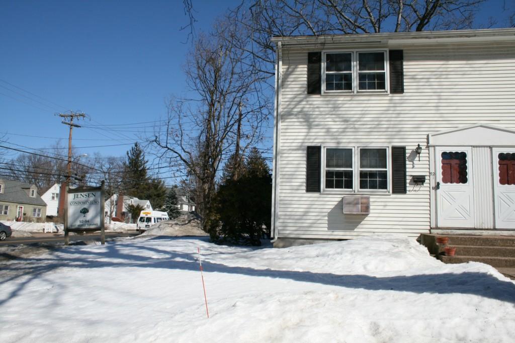 92 Middle Turnpike West, Unit 1 Manchester, CT 06040 - Photo 1 of 1 a view of a house with a yard