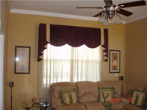 2531 Northwest Windemere Drive Stuart, FL 34994 - Photo 11 of 16 a living room with furniture and a window