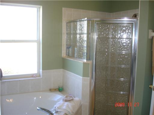 2531 Northwest Windemere Drive Stuart, FL 34994 - Photo 14 of 16 a bathroom with a shower