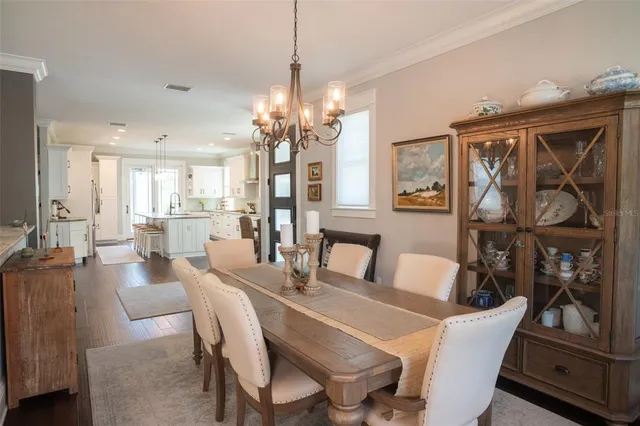 a view of a balcony with furniture and floor to ceiling window