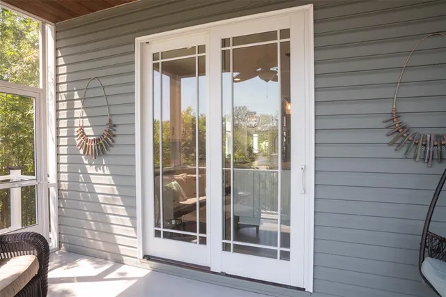 a view of a workspace with furniture and a bookshelf