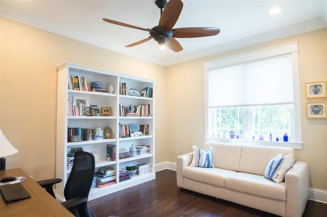 a bedroom with a bed and a television