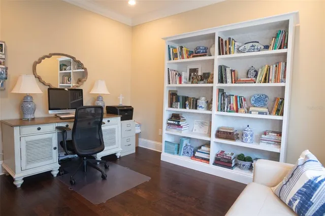 a view of a chairs and table in the balcony