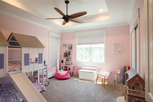 a spacious bathroom with a tub sink and mirror