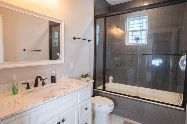 a bathroom with a sink double vanity and a mirror