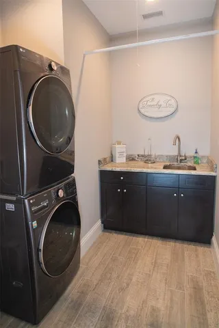 a white bath tub sitting in a bathroom next to a window