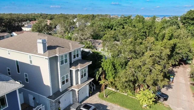 a backyard of a house with outdoor seating