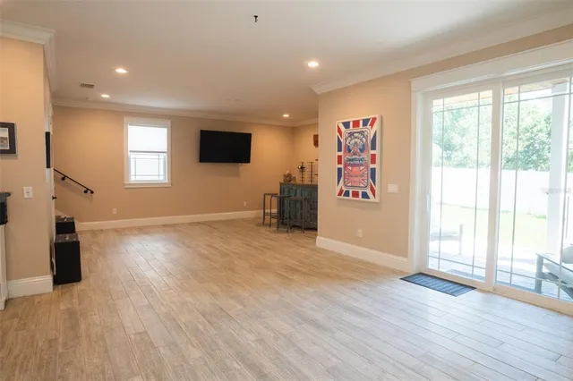 a view of entryway with wooden floor and stairs