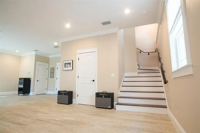 a kitchen with granite countertop white cabinets white appliances and a sink