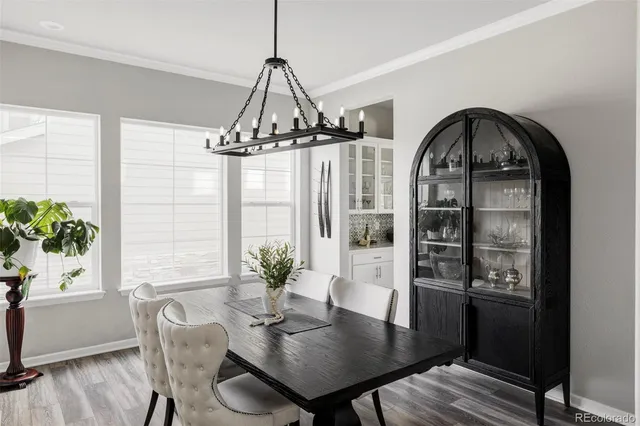 a view of a dining room with furniture window and wooden floor