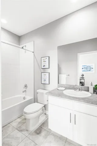 a kitchen with a stove and white cabinets