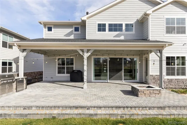 a view of a swimming pool with an outdoor seating