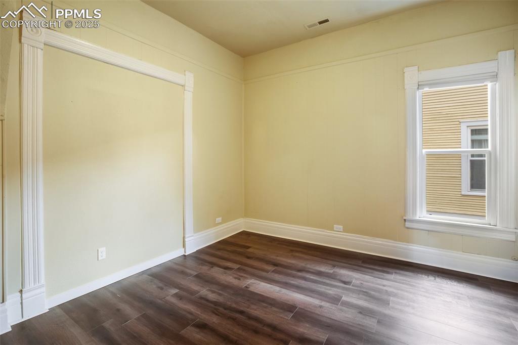 Undisclosed Address Pueblo, CO 81004 - Photo 15 of 23 a view of an empty room with wooden floor and a window