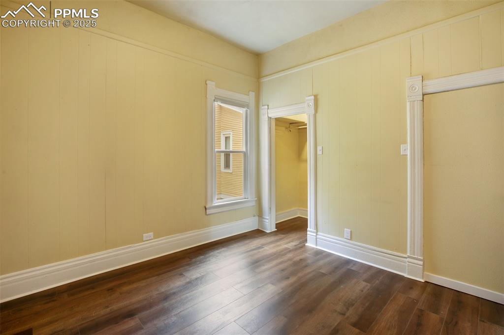 Undisclosed Address Pueblo, CO 81004 - Photo 16 of 23 an empty room with wooden floor