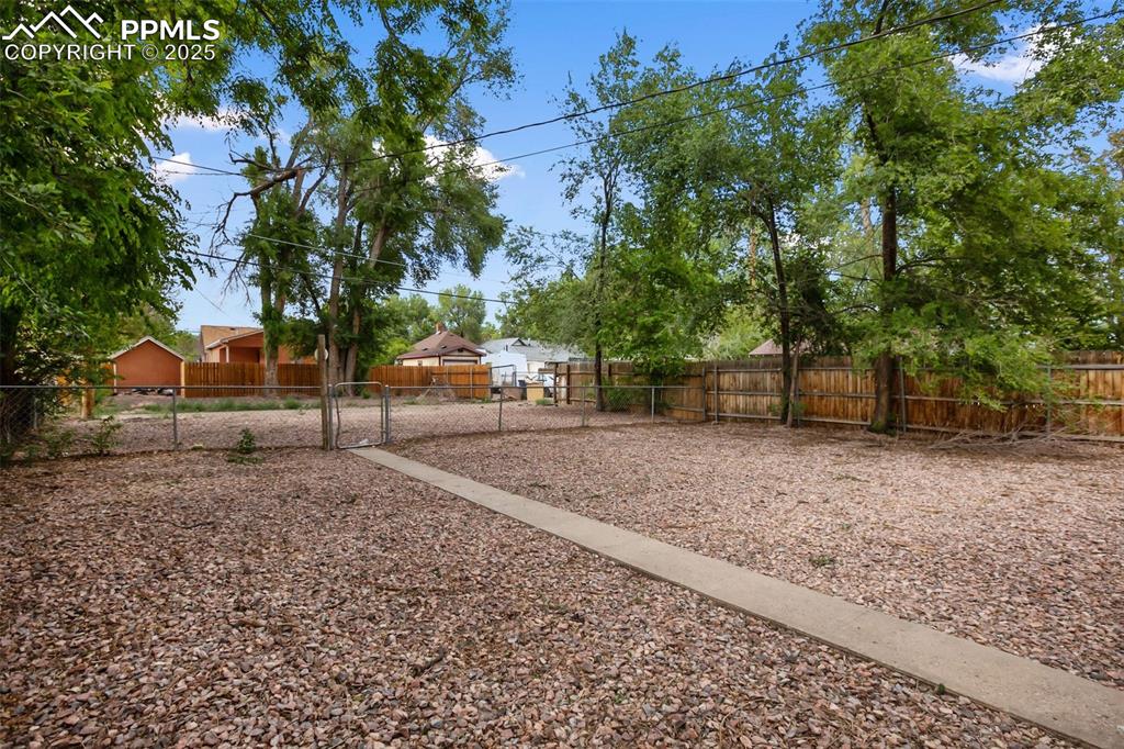 Undisclosed Address Pueblo, CO 81004 - Photo 20 of 23 a backyard of a house with lots of green space