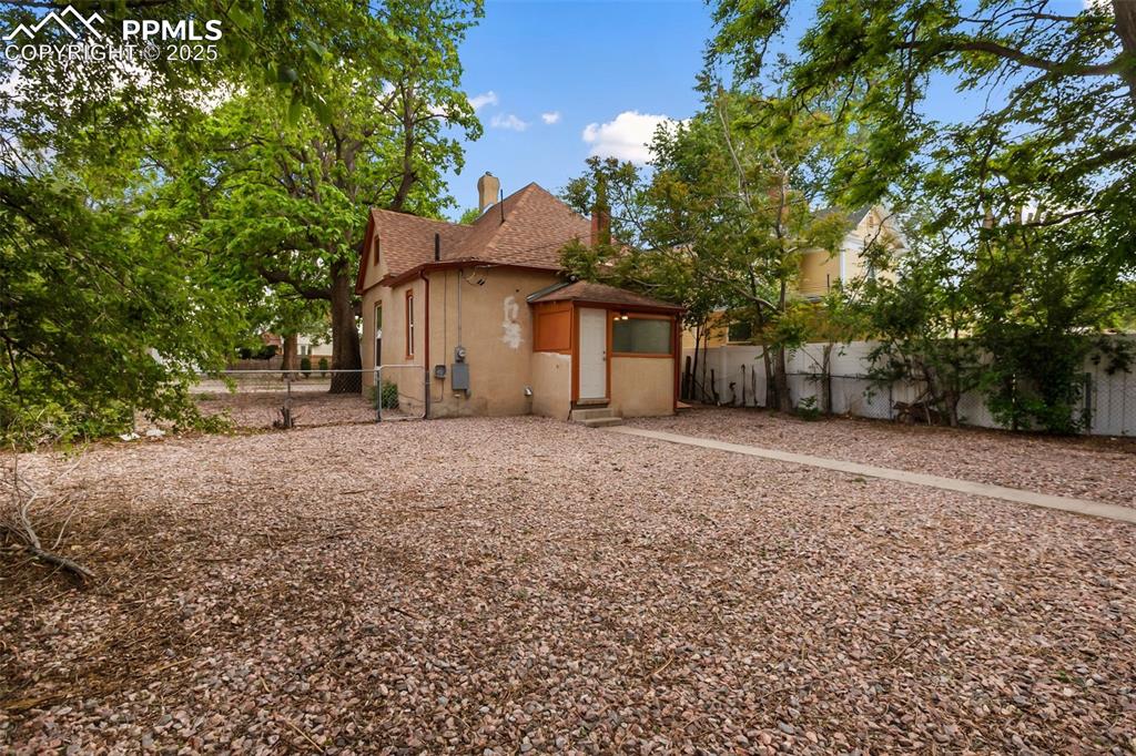 Undisclosed Address Pueblo, CO 81004 - Photo 22 of 23 a view of a house with a yard and large tree
