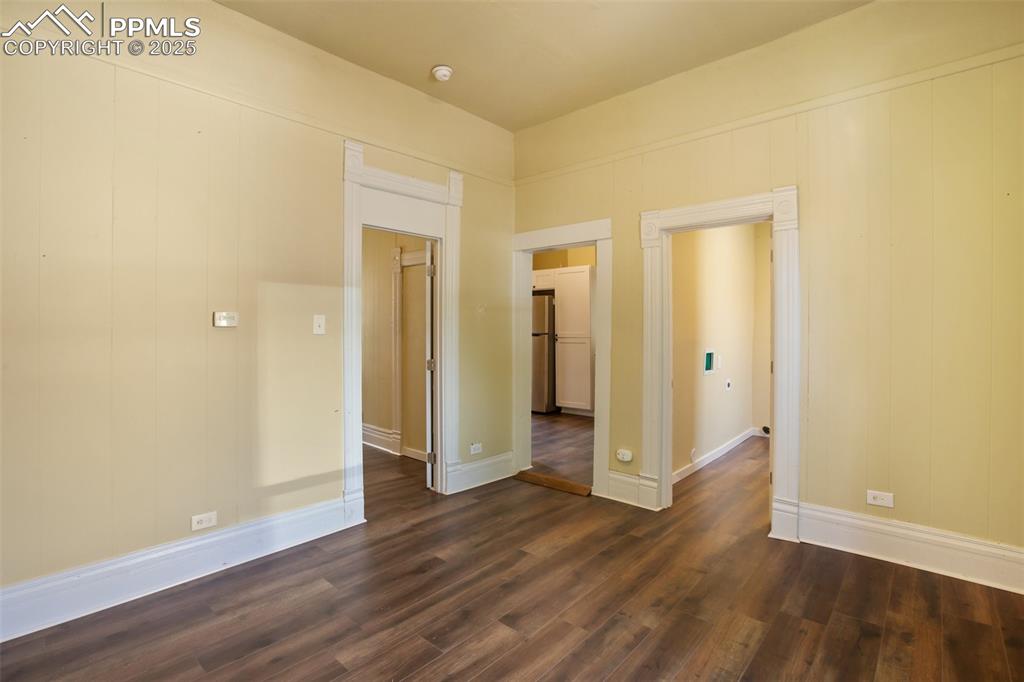 Undisclosed Address Pueblo, CO 81004 - Photo 4 of 23 a view of a hallway with wooden floor