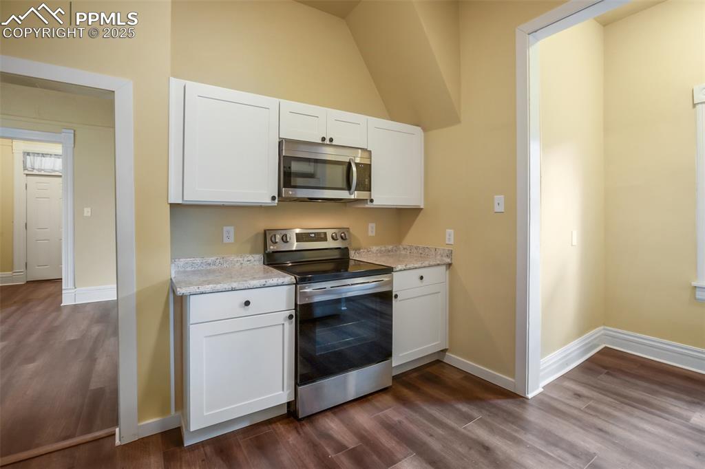 Undisclosed Address Pueblo, CO 81004 - Photo 6 of 23 a kitchen with stainless steel appliances a stove a microwave and sink