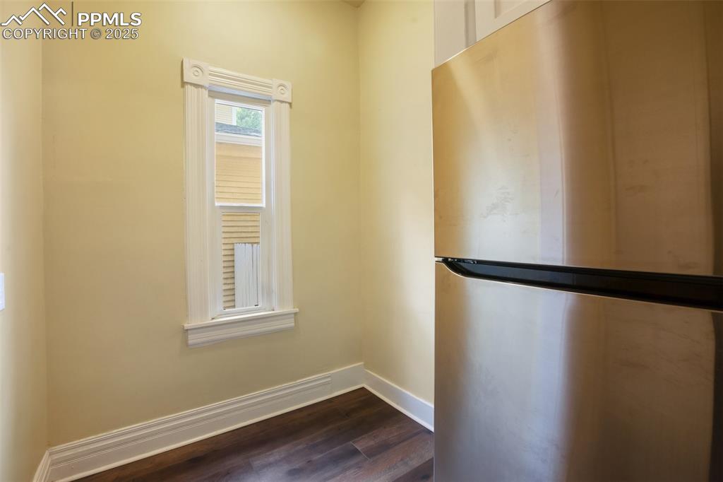 Undisclosed Address Pueblo, CO 81004 - Photo 9 of 23 a view of a room with wooden floor and windows