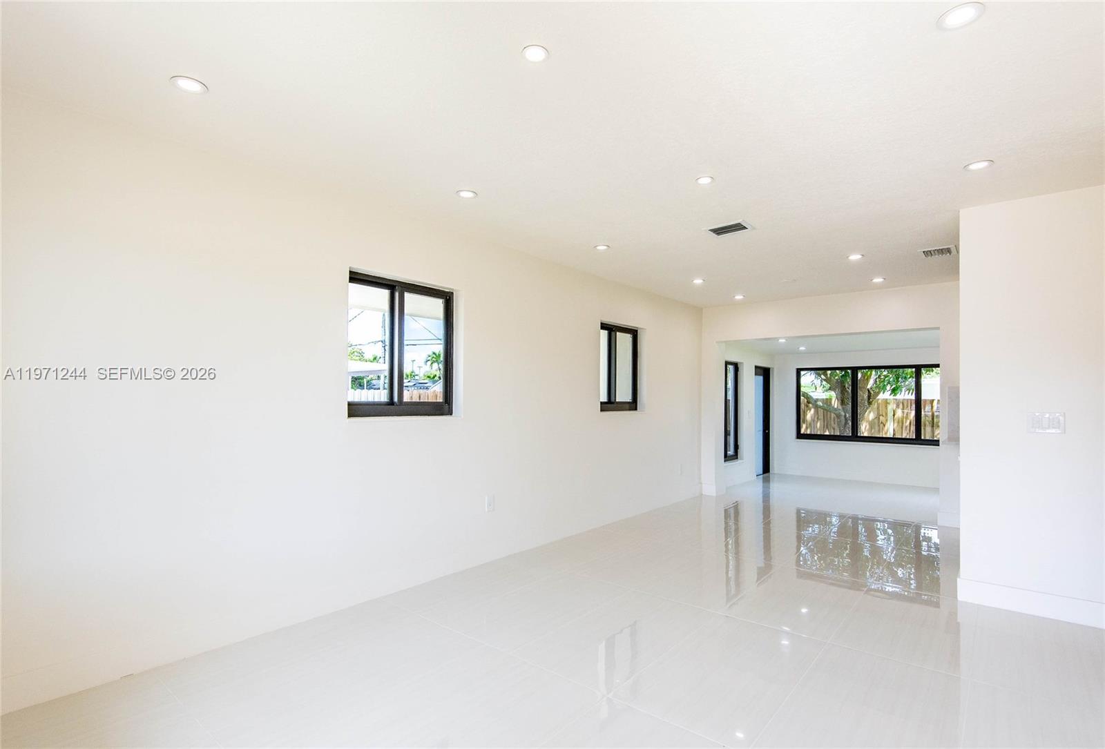11861 Southwest 185th Terrace Miami, FL 33177 - Photo 11 of 34 a view of livingroom with hardwood floor and a ceiling fan