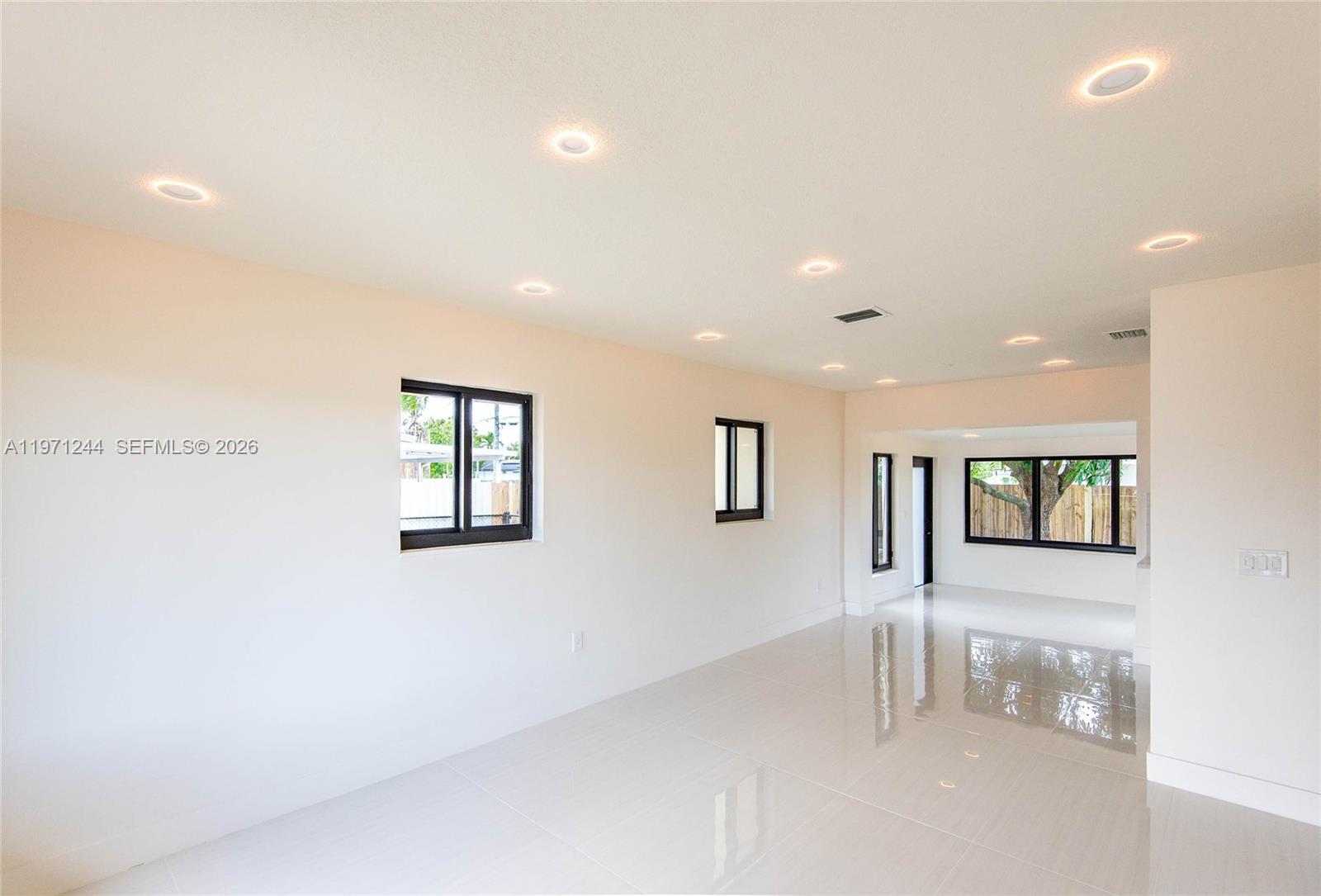 11861 Southwest 185th Terrace Miami, FL 33177 - Photo 12 of 34 a view of an empty room with a window