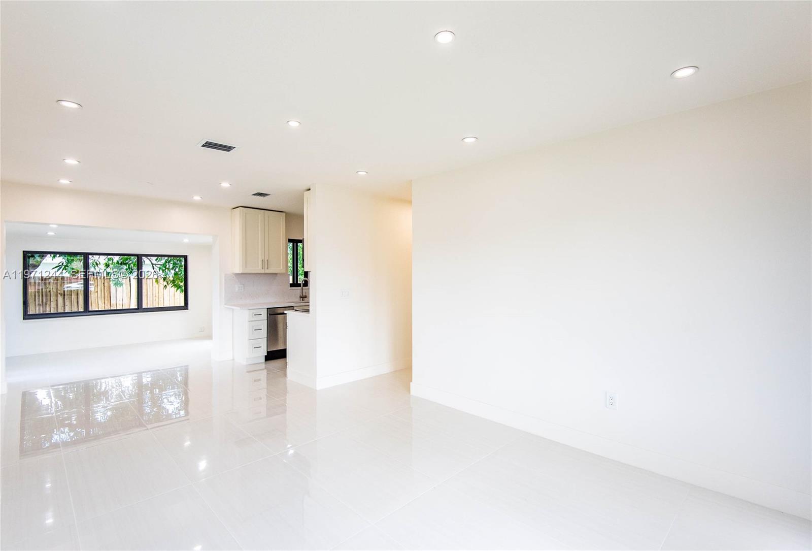 11861 Southwest 185th Terrace Miami, FL 33177 - Photo 14 of 34 a view of a kitchen with a refrigerator and a window