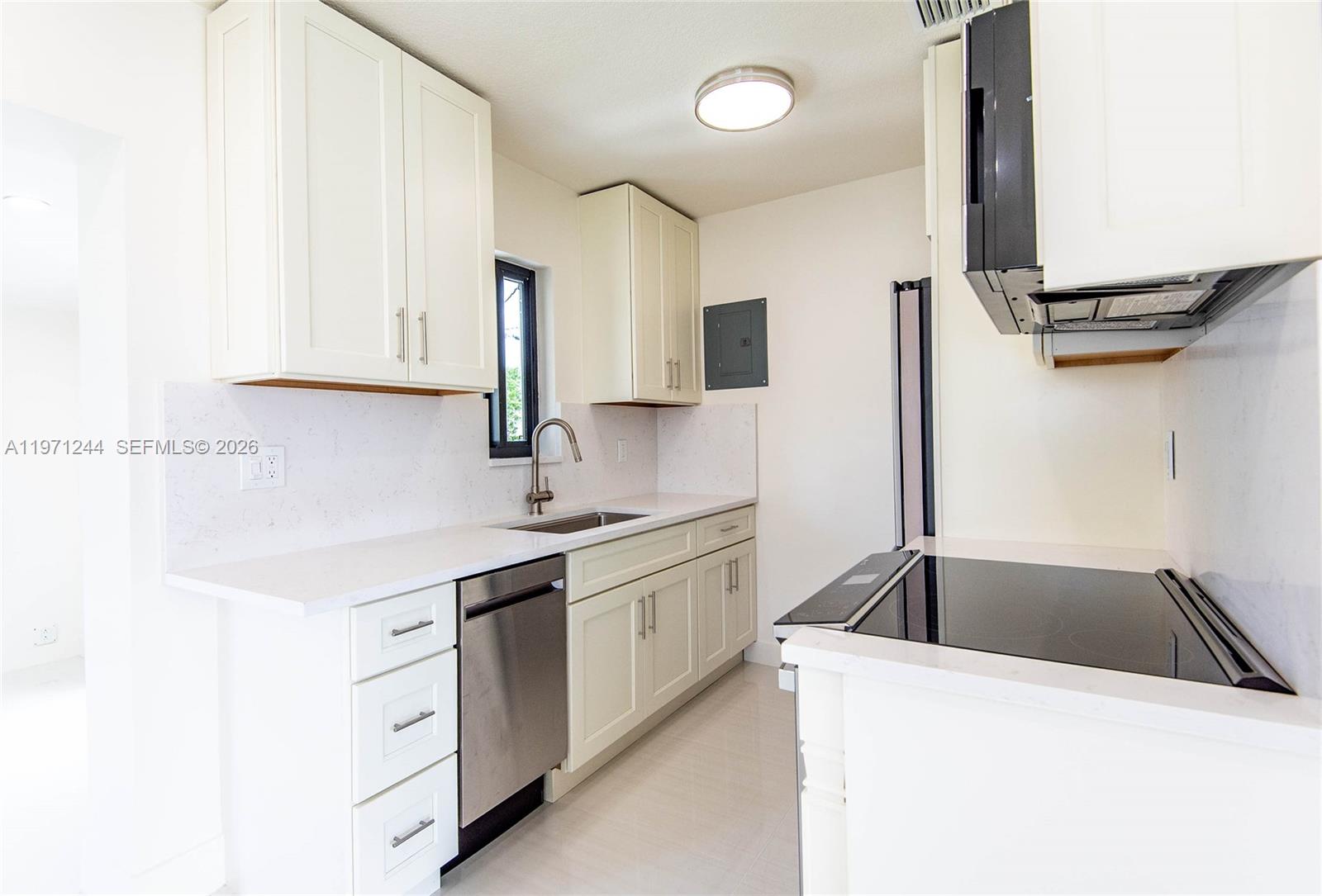 11861 Southwest 185th Terrace Miami, FL 33177 - Photo 19 of 34 a kitchen with a sink cabinets and appliances