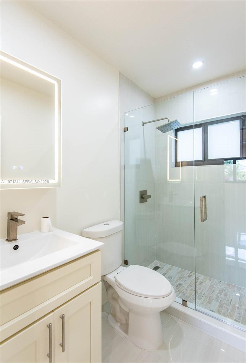 11861 Southwest 185th Terrace Miami, FL 33177 - Photo 20 of 34 a bathroom with a sink a toilet and shower