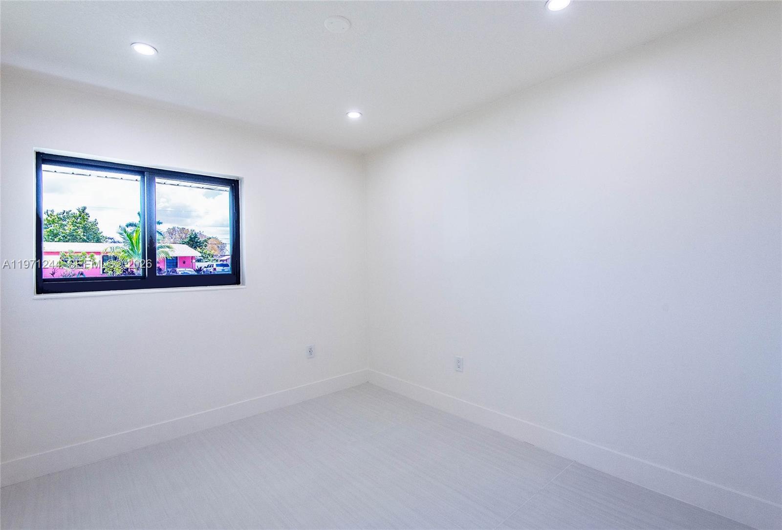 11861 Southwest 185th Terrace Miami, FL 33177 - Photo 21 of 34 an empty room with windows